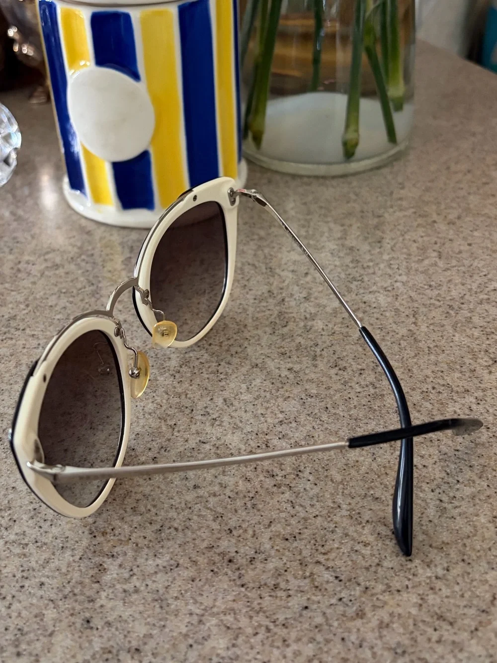 Prada Black and Gold Cat-Eye Sunglasses with Gradient Lenses